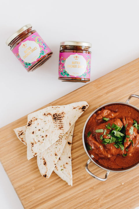 Delicious Butter Chicken served with garlic Naan